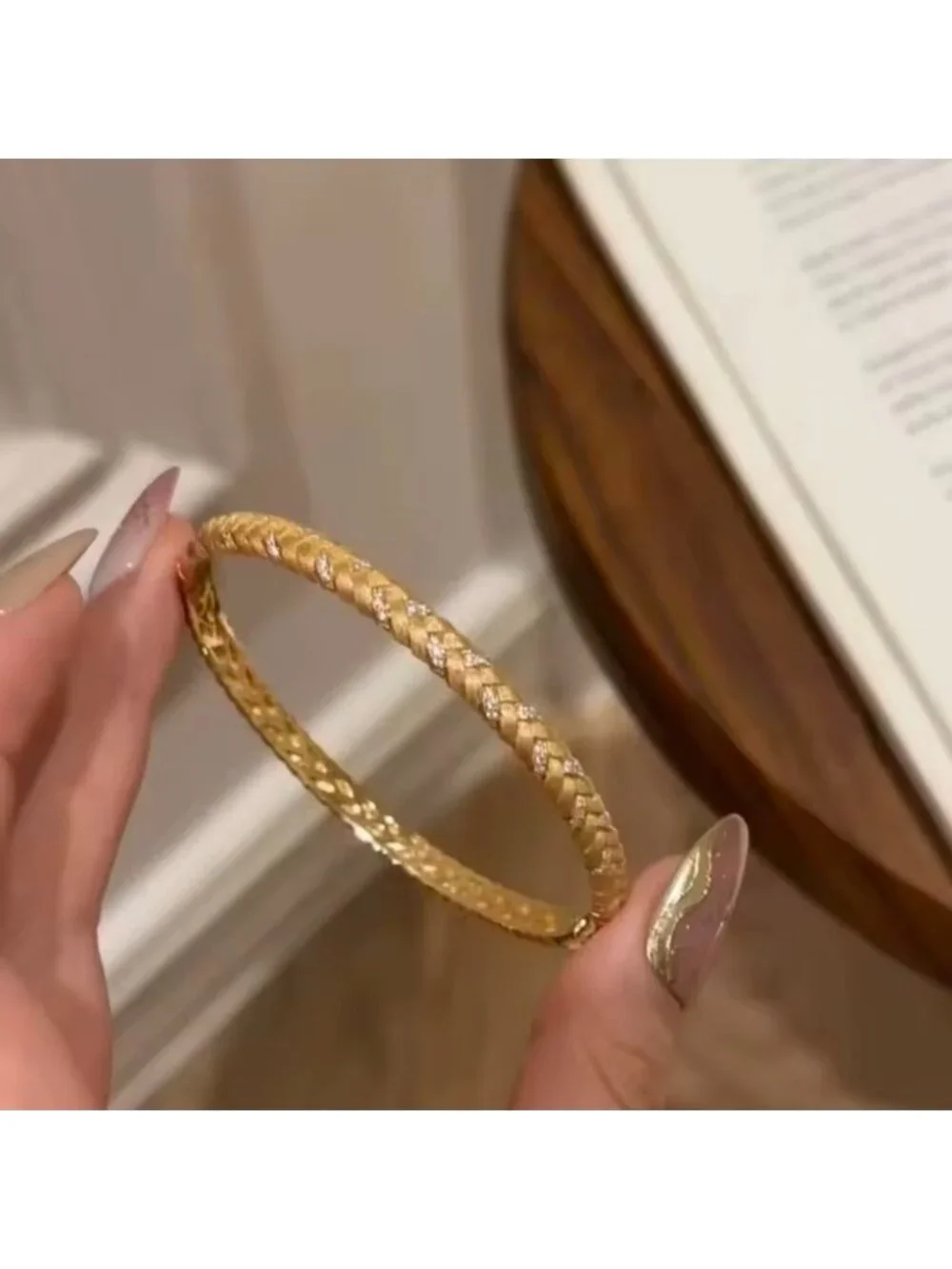 Gold Tone Braided Bangle with Clear Stone Accents